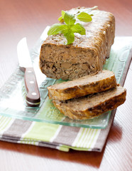 Meat loaf with basil leaves