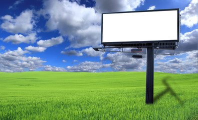 Big blank billboard in green field