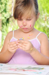 A child playing with colors