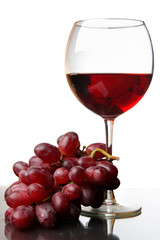Glass of red wine and grape