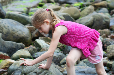 A Little Girl Finds Something Interesting on a Hike