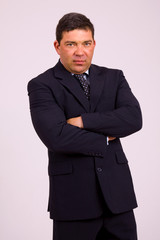 Fototapeta premium Portrait of a mature business man on a grey background