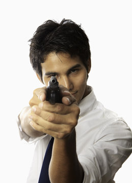 young asian man with automatic pistol