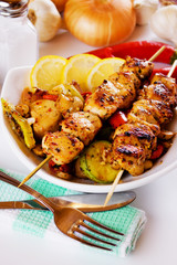 Grilled chicken meat on skewer