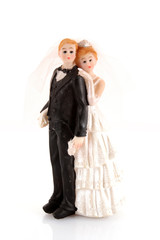wedding cake figurines on white