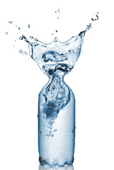 plastic bottle with water splash isolated on white