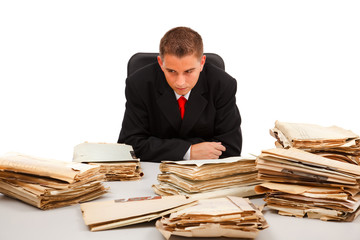 Man looking at lots of documents