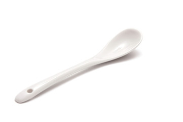 white spoon isolated on a white background