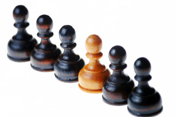 White pawn standing out in a row of black pawns , isolated