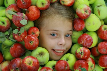 Fototapeta na wymiar Girls head in apples mass