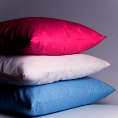 Fototapeta na wymiar pink, white and blue pillows