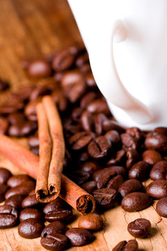 coffee beans, cup and cinnamon