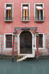 Fototapeta premium An old rustic hotel in the canals of Venice