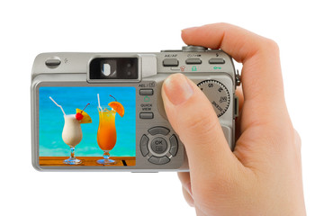 Hand with camera and landscape (my photo)