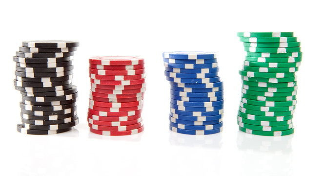 colorful poker casino chips over white background