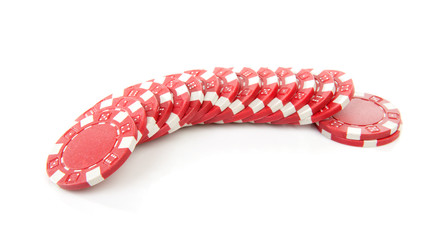 red poker casino chips over white background