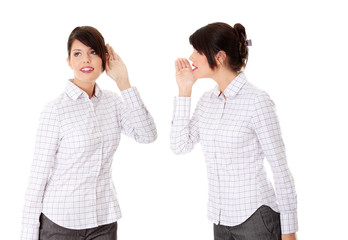 Businesswoman whispering