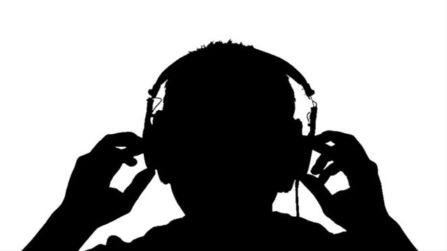 Silhouette of Man Listening to Headphones