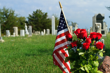 American Flag and in old graveyard