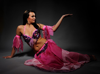 Beautiful sexy dancer woman in bellydance costume with pretty pr