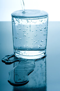 overflowed glass of water