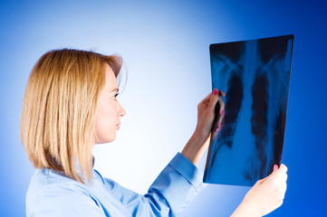 Female doctor carefully x-ray of patient