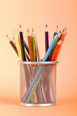 Many colorful pencils on the color background