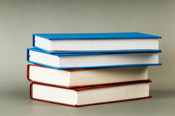 Stack of books on the color background