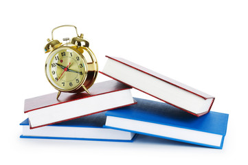 Back to school concept with books and clock