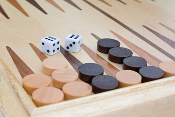 Wooden board for game in a backgammon and dice