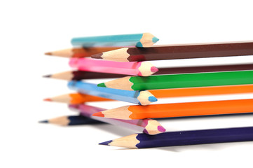 Assortment of colored pencils over white