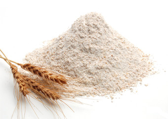 Whole flour pile or heap with wheat rye ears isolated on white background