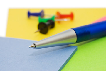 Pen and note isolated on white background