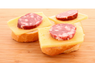 Sandwiches with sausage, cheese and bread