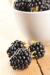 blackberries on wooden background