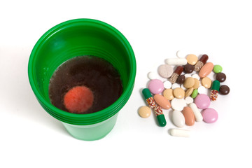 cup with water and pills