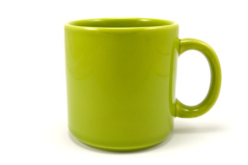 green ceramic teacup isolated on white background