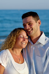 Obraz premium Happy young couple at beach