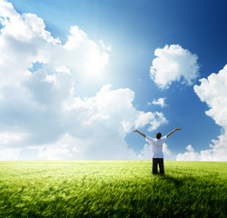 happy young man rest on wheat field