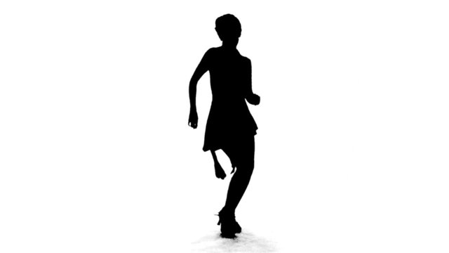 Silhouette of Woman Dancing Salsa
