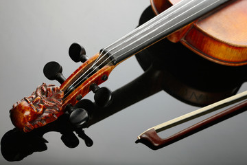 Violin and bow on dark background