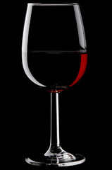 Naklejka na ściany i meble Glass of red wine isolated against black