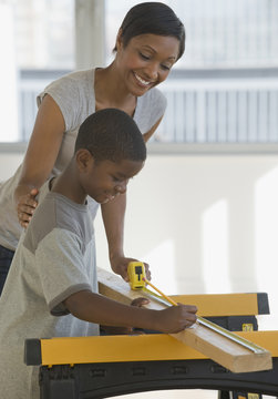 Mother and son with building materials