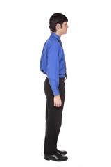 Caucasian businessman standing with arms at sides side view