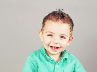 A young boy smiling