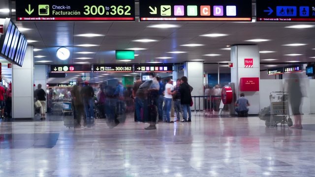 People hurrying in the Barajas T1 airport. TimeLapse movie.