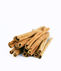 cinnamon sticks on white