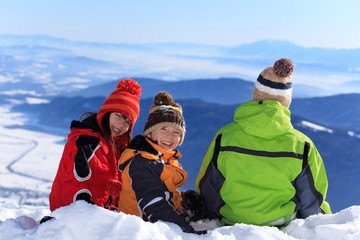 Three children in the snow