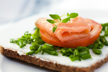 Delicious canape with salmon,tomato and chive