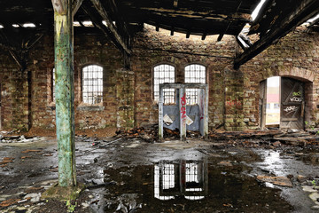 Smashed toilets in a derelict warehouse